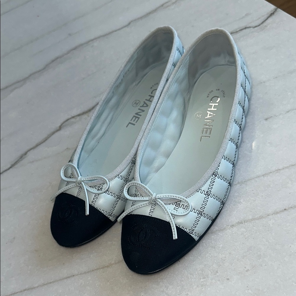 CHANEL Black and White Flats for Timeless Elegance